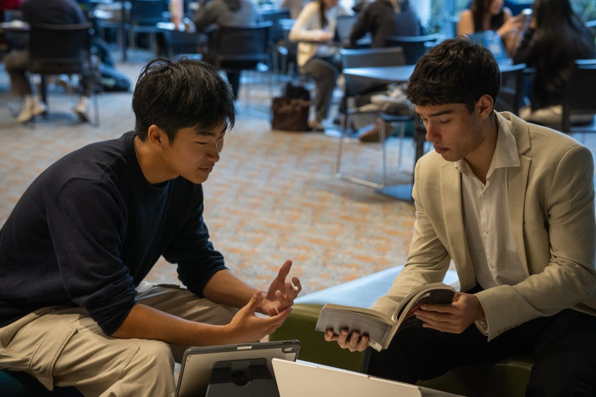 Tutor clarifying a concept with a student